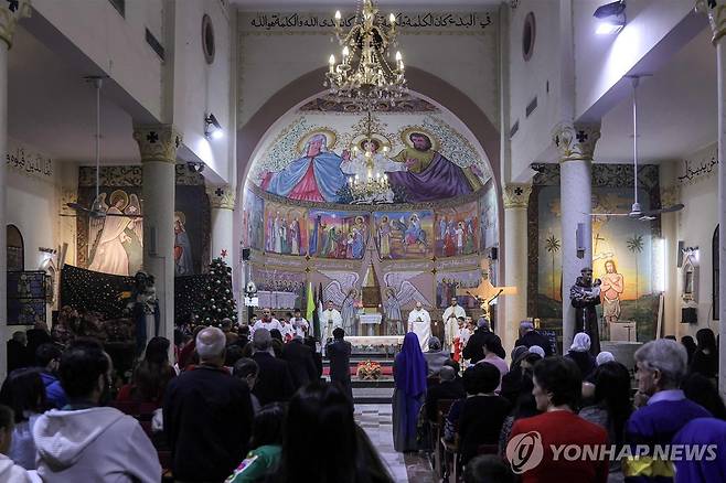 크리스마스 이브 가자시티 가톨릭성당의 미사 [AFP 연합뉴스 자료사진. 재판매 및 DB 금지]