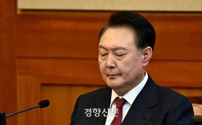 President Yoon Suk-yeol closes his eyes as if he is tired at the fourth hearing of his impeachment trial held at the Constitutional Court in Seoul on January 23.