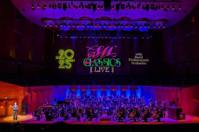 Minho of SHInee delivers opening remarks at SM Classics Live on Friday at the Seoul Arts Center. (SM Entertainment)