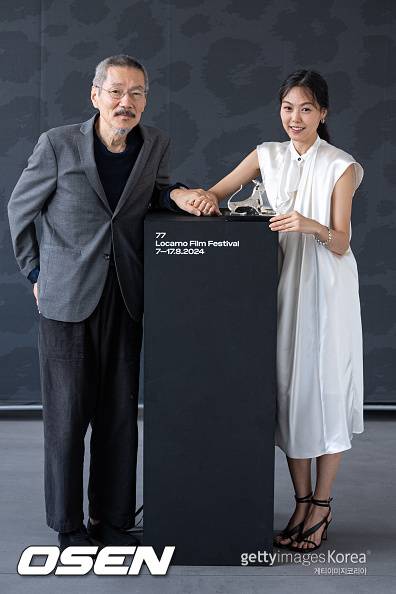 LOCARNO, SWITZERLAND - AUGUST 17: Hong Sang-Soo and Kim Minhee attend a photocall for Palmares at the 77th Locarno Film Festival on August 17, 2024 in Locarno, Switzerland. (Photo by Alessandro Levati/Getty Images)