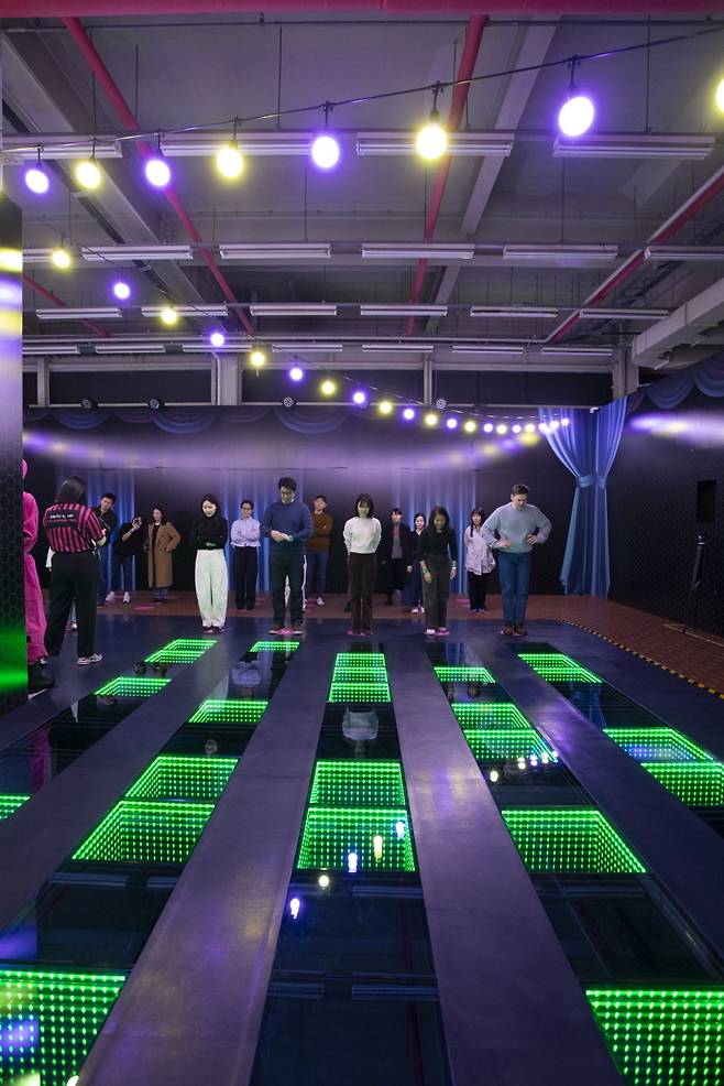 Participants attempt the memory steps stage at the Seoul edition of "Squid Game: The Experience" (Netflix)