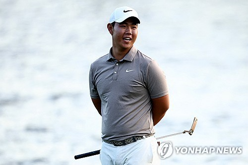 그린에서 활짝 웃는 김주형. 사진[AFP/게티이미지=연합뉴스]