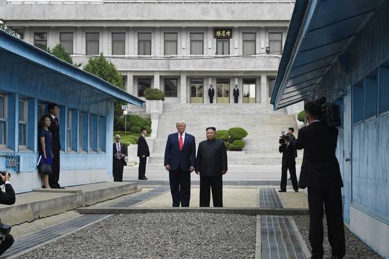 U.S. President Donald Trump, left, meets with North Korean leader Kim Jong-un at the border village of Panmunjom in the demilitarized zone on June 30, 2019. [AP/YONHAP]