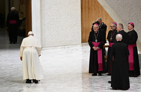 Pope Francis, far left, walks to meet with performers of the living Nativity scene of the Saint Mary Major Basilica at the Vatican on Dec. 16, 2023. [EPA/YONHAP]