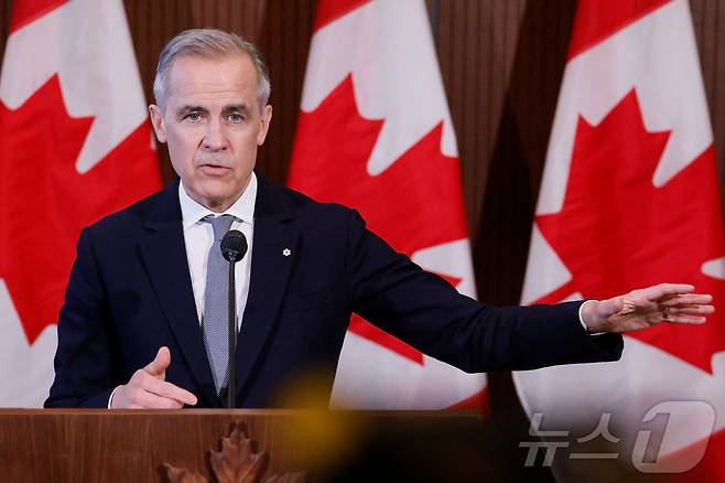 마크 카니 캐나다 총리가 27일(현지시간) 온타리오주 오타와에서 기자회견을 갖고 "도널드 트럼프 미국 대통령과 하루나 이틀 안에 대화를 나눌 것＂이라고 밝히고 있다. 2025.03.28 ⓒ 로이터=뉴스1 ⓒ News1 우동명 기자