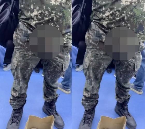 군복을 입은 남성이 바지 지퍼를 내린 채 신체 중요 부위를 노출하고 있다. /엑스 캡처