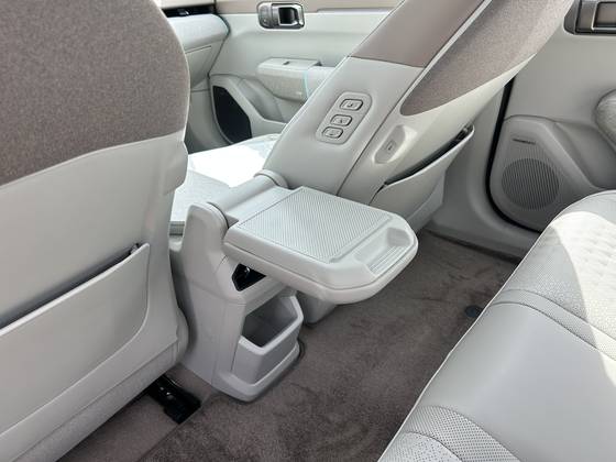 The EV4 has an armrest that folds open a full 180 degrees so that rear-seat passengers can also use it as a flat table. [SARAH CHEA]