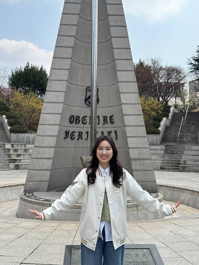 Jeon Yoon-jeong poses for a photo in front of the Albatross Tower at Sogang University after an interview with The Korea Herald on April 10. (Choi Jae-hee/The Korea Herald)