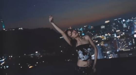 Jennie wears Leje's structured top etched with mother-of-pearl inlay in her music video for ″Seoul City,″ released on April 26.