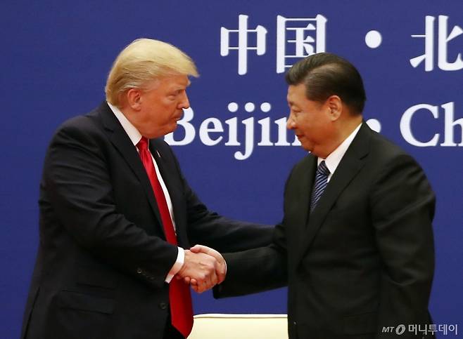 President Donald Trump and Chinese President Xi Jinping XXXXXXX at the Great Hall of the People, Thursday, Nov. 9, 2017, in Beijing, China. Trump is on a five country trip through Asia traveling to Japan, South Korea, China, Vietnam and the Philippines. (AP Photo/Andrew Harnik)