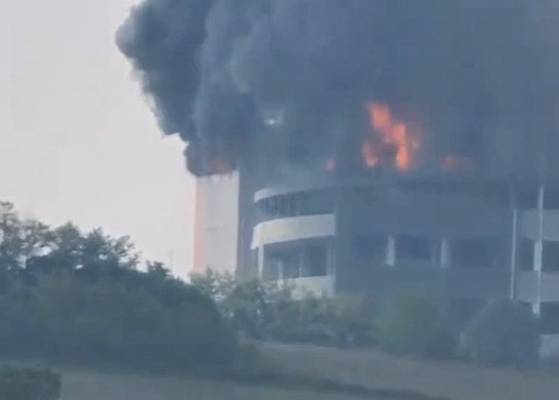 Flames and black smoke from a fire that broke out at a logistics center in Icheon, Gyeonggi, are pictured on May 13. [YONHAP]