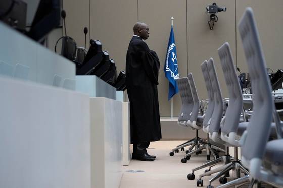 Deputy Prosecutor Mame Mandiaye Niang waits for former Philippine President Rodrigo Duterte to appear via video link before the International Criminal Court, in The Hague, Netherlands, on March 14. [REUTERS/YONHAP]