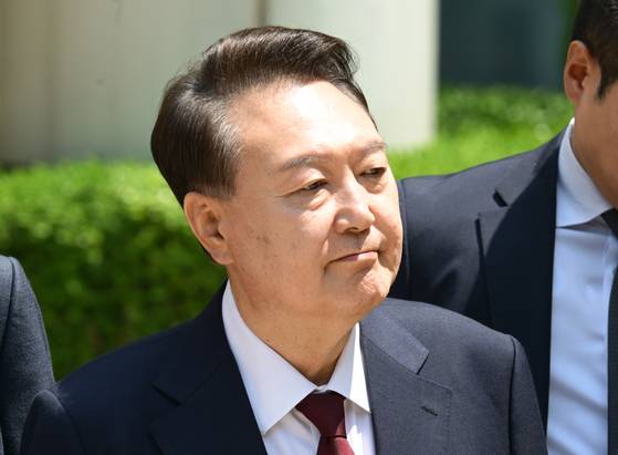 Former President Yoon Suk Yeol leaves the Seoul Central District Court in Seocho District, southern Seoul, on May 12 after the morning session of his third trial on charges including masterminding a rebellion while declaring martial law on Dec. 3, 2024. [JOINT PRESS CORPS]
