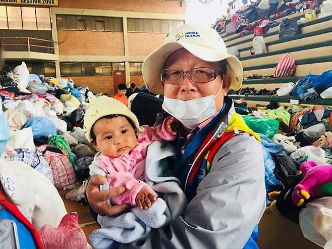 ▲ 볼리비아 수해현장 봉사활동 장면