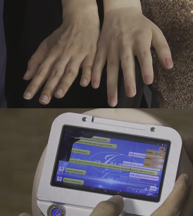 성인용 로봇의 손과 기자의 손을 비교해 봤다. 핏줄까지 제법 자연스럽게 모사했지만, 머리에는 각종 설정을 세팅하기 위한 모니터가 달려있다.