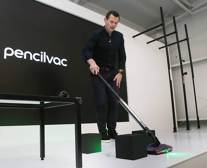 Tom Moody, president at Dyson Home, demonstrates the new PencilVac vacuum cleaner during a press briefing in Seoul on Monday. (Dyson)