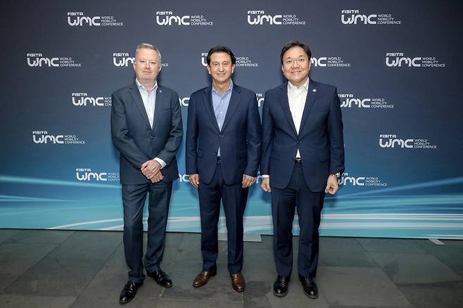 From left: FISITA CEO Chris Manson, Hyundai Motor Company President and CEO Jose Munoz and Kim Chang-hwan, head of electrification energy solutions at Hyundai Motor Group and new FISITA president, pose for a photo during the FISITA World Mobility Conference 2025 held in Barcelona, Spain, on Tuesday. (Hyundai Motor Group)