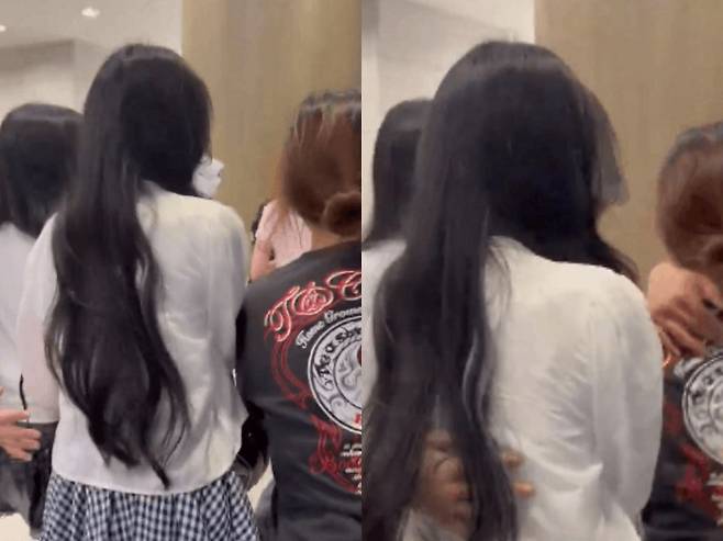 멤버들을 밀치는 여성의 모습 [X 캡처]