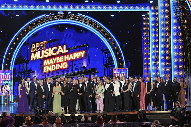 The cast and crew of ″Maybe Happy Ending″ accept the award for Best Musical for during the 78th Tony Awards on June 8, 2025, at Radio City Music Hall in New York. (Photo by Charles Sykes/Invision/AP)