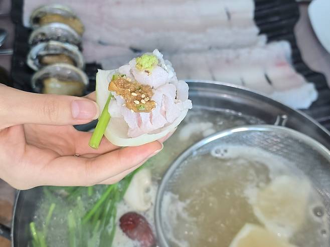Pike eel paired with thinly sliced raw onion and chives, topped with ssamjang [JANGHEUNG COUNTY OFFICE]