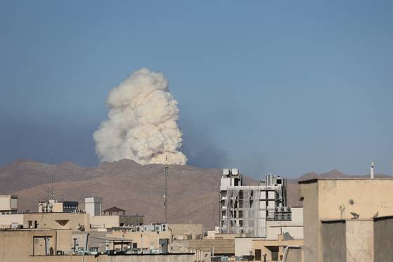 Smoke rises following an Israeli attack in Tehran on June 18. [REUTERS/YONHAP]