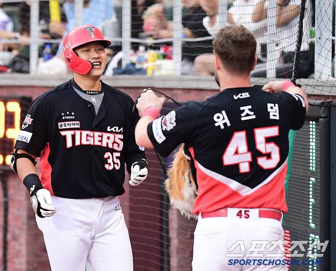 위즈덤이 건네는 호랑이 세리머니.