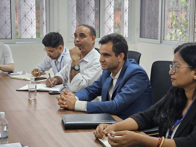 Krishna Timsina (third from left), executive director of Nepal’s National Agricultural Research Council, speaks during an interview at KOPIA's Nepal center on June 12. (Joint Press Corps)