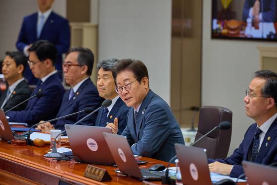 President Lee Jae Myung, center, speaks during a Cabinet meeting at the presidential office in Yongsan District, central Seoul, on June 24. [PRESIDENTIAL OFFICE]