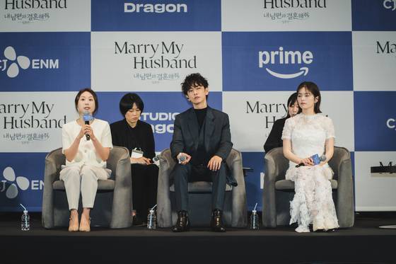 Producer Sohn Ja-young, left, and actors Sato Takeru and answer questions from reporters during a press conference held on June 26 for the Japanese remake of ″Marry My Husband″ drama series. [CJ ENM]