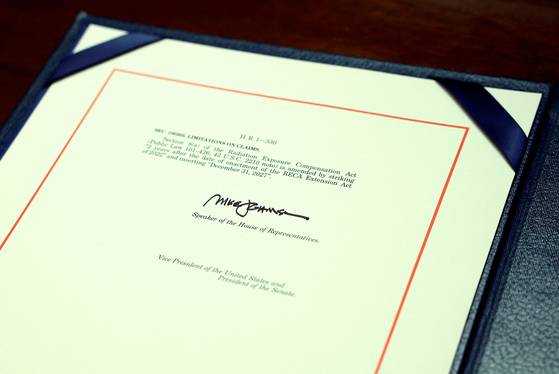 The One Big Beautiful Bill Act is seen during an enrollment ceremony at the U.S. Capitol in Washington on July 3. The House passed the sweeping tax and spending bill after winning over fiscal hawks and moderate Republicans. The bill makes permanent U.S. President Donald Trump's 2017 tax cuts, increases spending on defense and immigration enforcement and temporarily cut taxes on tips, while at the same time cutting funding for Medicaid, food assistance for the poor and clean energy, and raises the nation's debt limit by $5 trillion. [AFP/YONHAP]