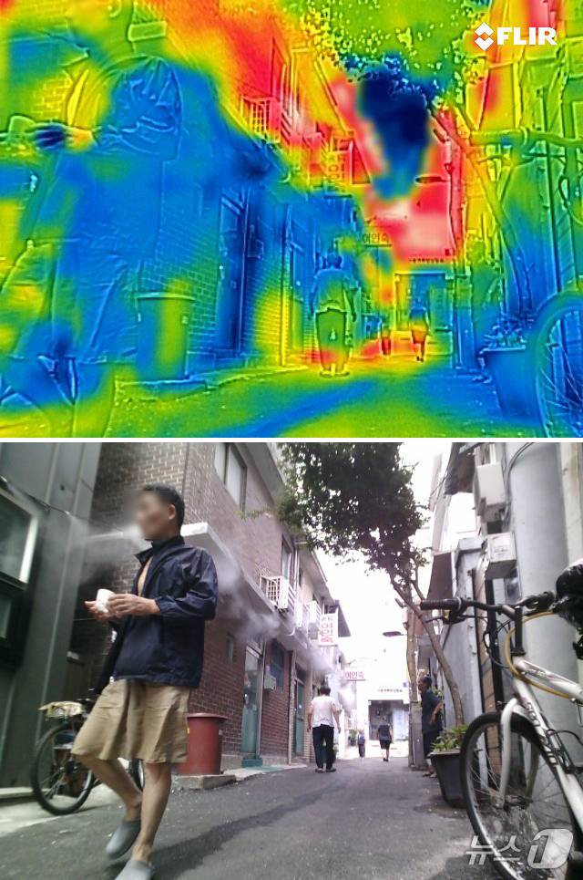 8일 오후 서울 용산구 동자동 쪽방촌에서 쿨링포그가 가동되는 골목을 열화상카메라로 촬영한 모습. 쿨링포그의 영향을 거의 받지 앉는 2층과 온도차가 크게 나타나고 있다. 이날 오후 2시쯤 서울 기온은 37.1도까지 오르면서 7월 상순 기온으론 역대 최고치를 기록했다. 2025.7.8/뉴스1 ⓒ News1 구윤성 기자