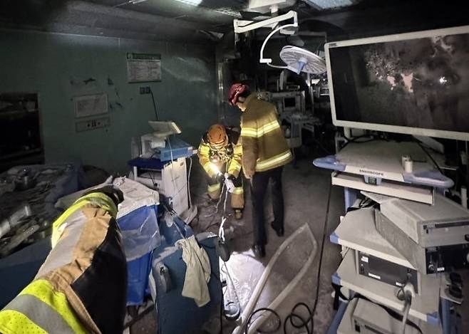 Firefighters respond after a blaze broke out in an operating room at Chosun University Hospital in Dong-gu, Gwangju, on Monday. (Yonhap)