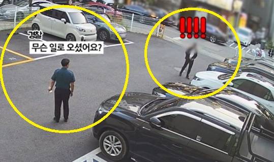 지난 5월 26일 대전유성경찰서 유성지구대 강희국 경감(왼쪽)이 주차장에서 음주 운전자로 추정되는 남성에게 대화를 시도하고 있다. [사진 대전경찰청]