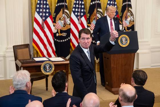 Repblican Senator Bill Hagerty gives a thumbs-up after being hailed by US President Donald Trump during a bill signing for cryptocurrency legislation in the East Room of the White House in Washington on July 18. [EPA/YONHAP]