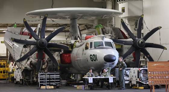 An airborne command aircraft is seen inside the hanger of the USS Theodore Roosevelt at the Busan Naval Base in Busan on June 22, 2024. [JOONGANG ILBO]