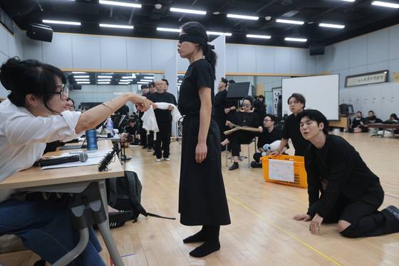 Director Yona Kim, left, directs a rehearsal during a press event for the National Changgeuk Company of Korea’s new production of "Shimcheong" at the National Theater of Korea in central Seoul on July 30. [YONHAP]