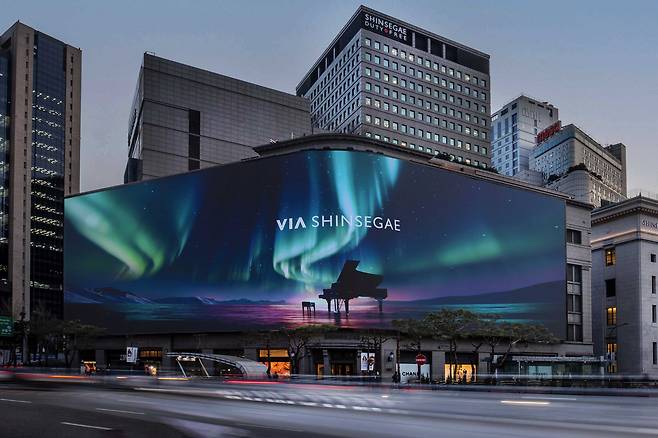 A digital billboard on the exterior of Shinsegae Department Store's main branch in Myeong-dong, central Seoul, displays an image of "Via Shinsegae," on Aug. 4. Via Shinsegae is the new premium travel platform set to launch on Aug. 5 by Shinsegae Department Stores alongside a premium online shopping channel, "Beyond Shinsegae." [Shinsegae Department Store]