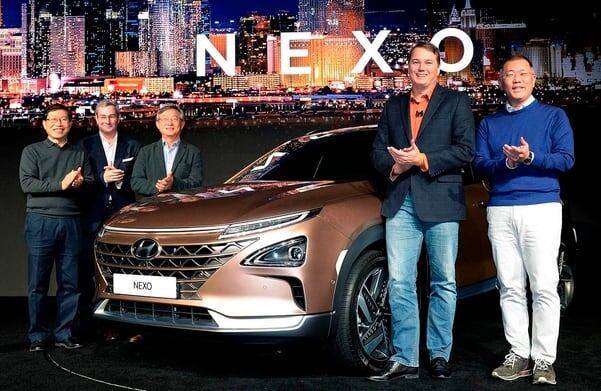 Hyundai Motor unveiled its futuristic SUV, the Nexo, at CES in 2018. At the time, the company also announced a joint project with Aurora to develop autonomous driving technology. Pictured are Hyundai Motor Executive Chair Chung Eui-sun (far right) and Aurora Innovation CEO Chris Urmson (second from right)./Hyundai Motor Company
