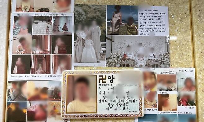 유족이 군무원 양아무개씨 납골당에 놓은 가족사진. 양씨 사망 이후 세상에 나온 둘째 아이는 아빠를 사진으로만 만날 수 있다. 유족 제공
