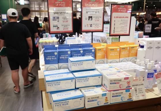 Face masks are stocked at a shopping mall in Seoul on June 14, 2020, during the height of the Covid-19 pandemic. [YONHAP]