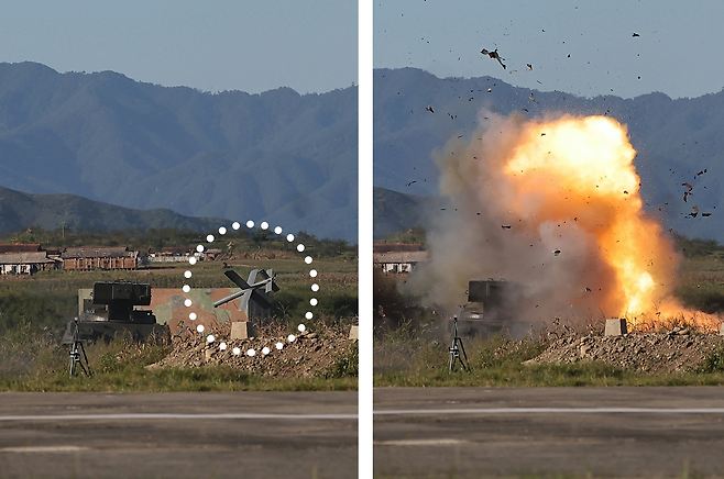 북한의 자폭형 무인기(점선 안)가 18일 표적을 타격하며 폭발하는 모습을 북한 노동신문이 19일 보도했다. 북한은 과거 무인기를 보도할 때 모자이크로 처리했지만, 이번엔 모자이크 없이 공개했다. 노동신문 뉴스1