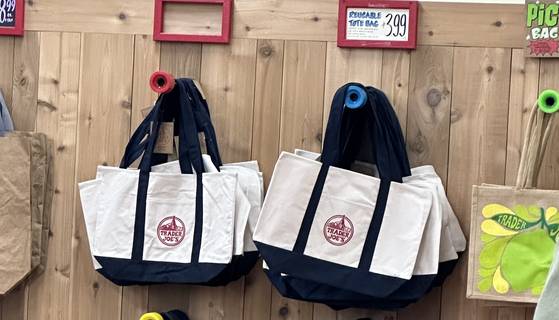 Trader Joe's canvas tote bags hang on the wall at Trader Joe's store in Los Angeles. [CHO YONG-JUN]