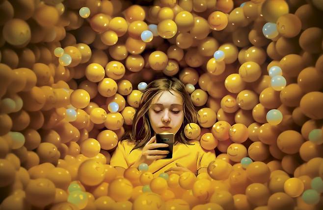 사회심리학자 조너선 하이트 미국 뉴욕대 교수가 쓴 '불안 세대(The Anxious Generation)' 영문판 표지. 한 청소년이 스마트폰을 보며 '좋아요' 같은 이미지들에 포위돼 있다. /아마존