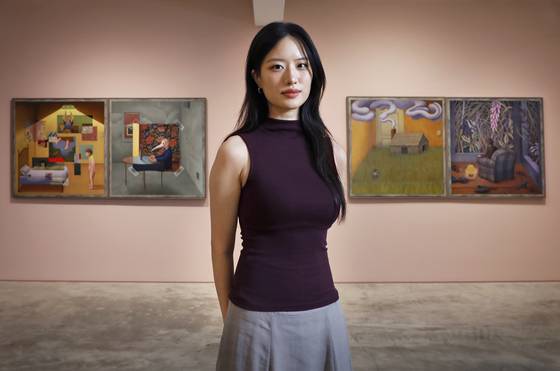 Artist Yeon Yeo-in poses for photos with the Korea JoongAng Daily at her solo exhibit "The House That My Mother Buit" on display at the DIA Contemporary gallery in Jongno District, central Seoul through Sept. 27. [PARK SANG-MOON]