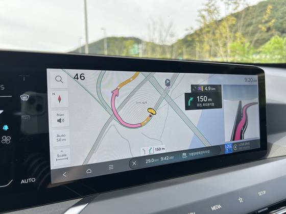 On the navigation, the EV5's icon is a Mickey Mouse footprint, and after making either a U-turn, the icon doesn't reset properly and shows the route in reverse. [SARAH CHEA]