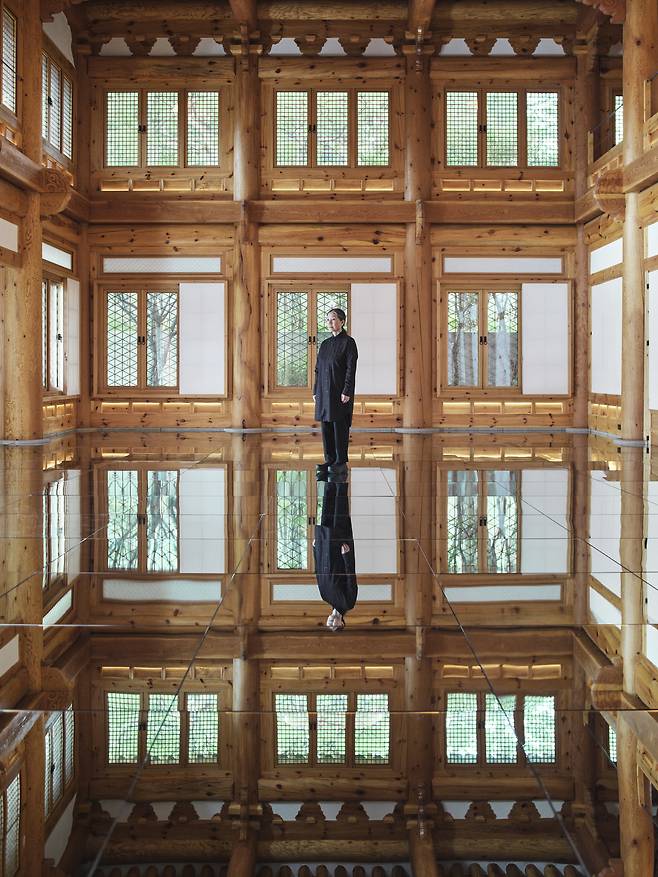 Kim Soo-ja poses for a photo at the installation "Breathe — Sunhyewon" (Courtesy of the artist, Podo Museum)