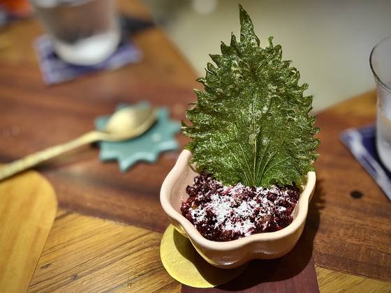 Curried rice, a comfort dish in southern India, is reimagined with beetroot, Spanish goat cheese and a side of crunchy shiso tempura at Papa's, a fine dining restaurant in Mumbai [LEE JIAN]