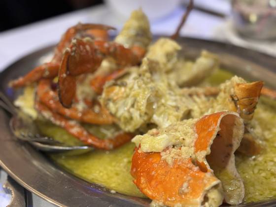 Locally caught mud crab steamed and doused in hot butter and garlic served at Mumbai's staple seafood restaurant Trishna [LEE JIAN]