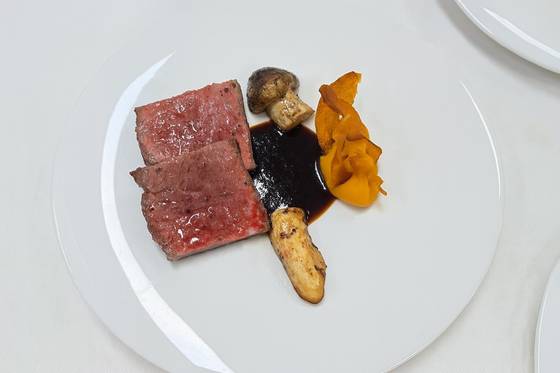 Hanwoo (Korean beef) sirloin from host city Gyeongju, served with sweet pumpkin puree, Namsan pine mushrooms and soy sauce beef jus [PRESIDENTIAL OFFICE]