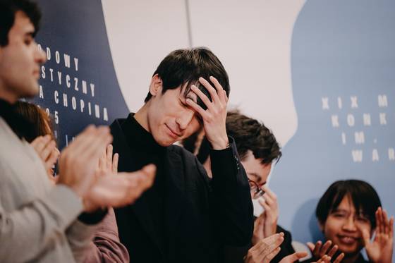 Pianist Eric Lu is seen after the announcement of results during the final stage of the 19th International Fryderyk Chopin Piano Competition at Warsaw Philharmonic Hall in Warsaw, Poland, on Oct. 21. [CHOPIN INSTITUTE]